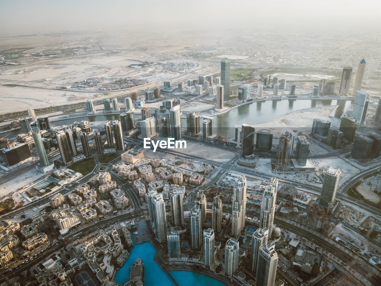 HIGH ANGLE VIEW OF BUILDINGS AGAINST SKY