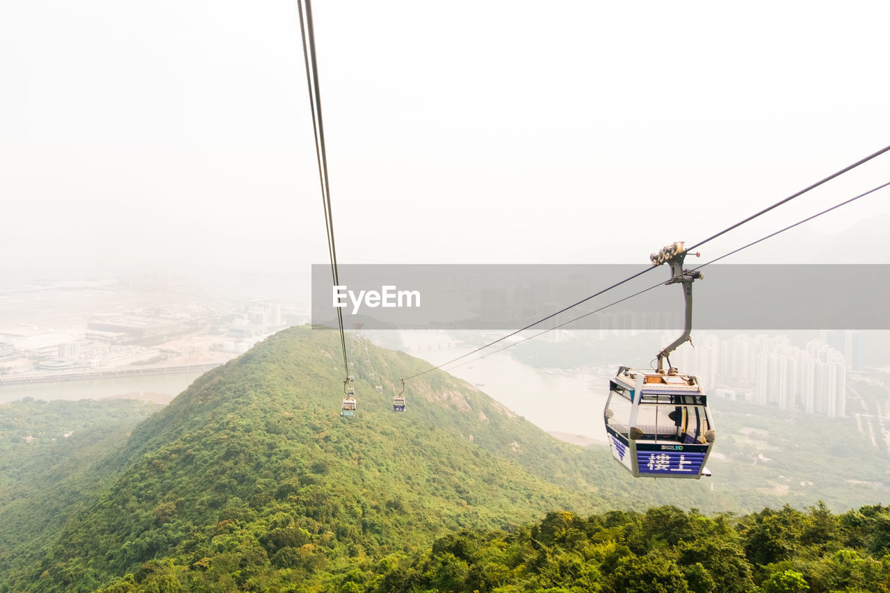 OVERHEAD CABLE CAR AGAINST SKY