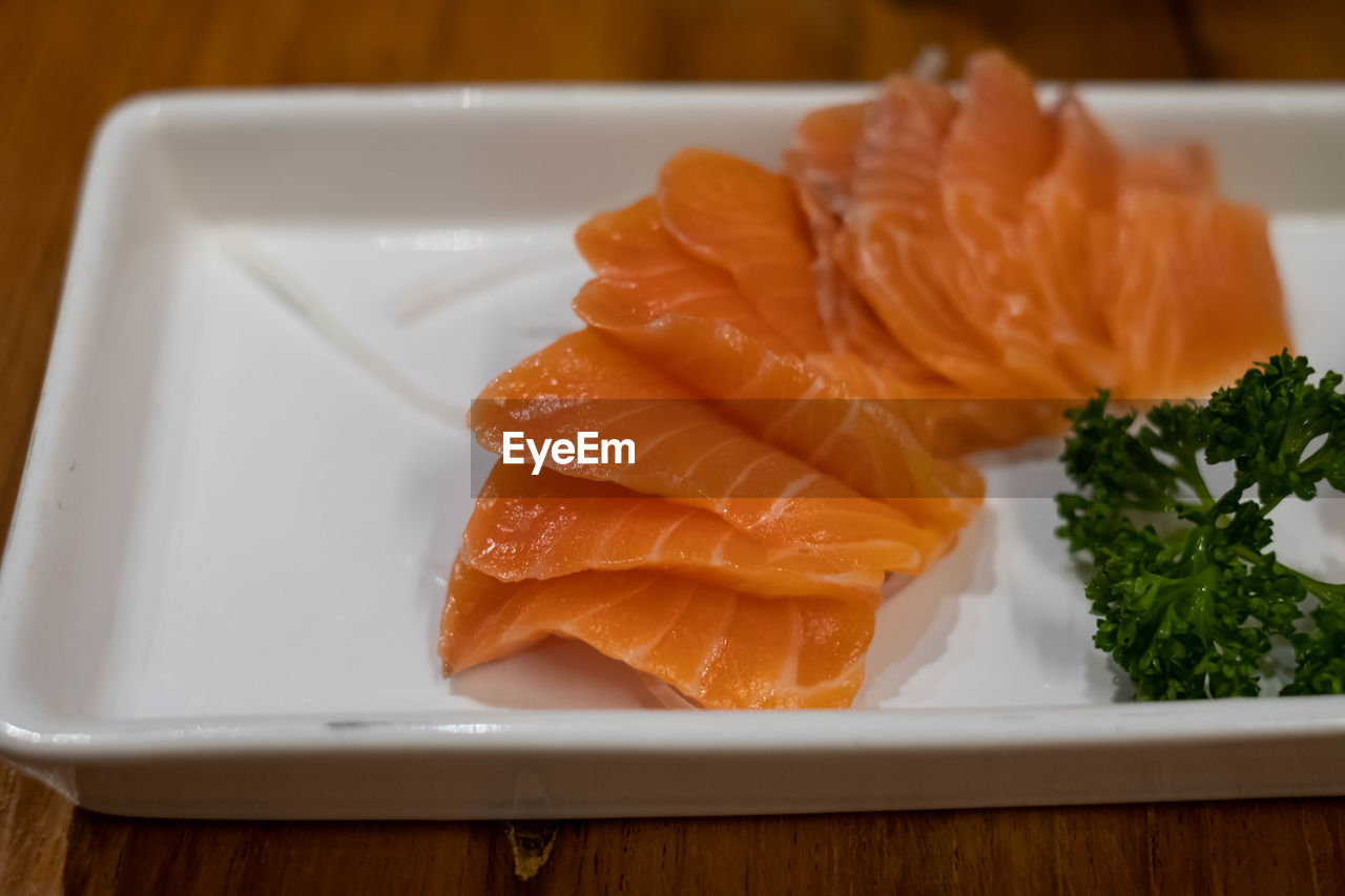 CLOSE-UP OF FISH SERVED ON PLATE