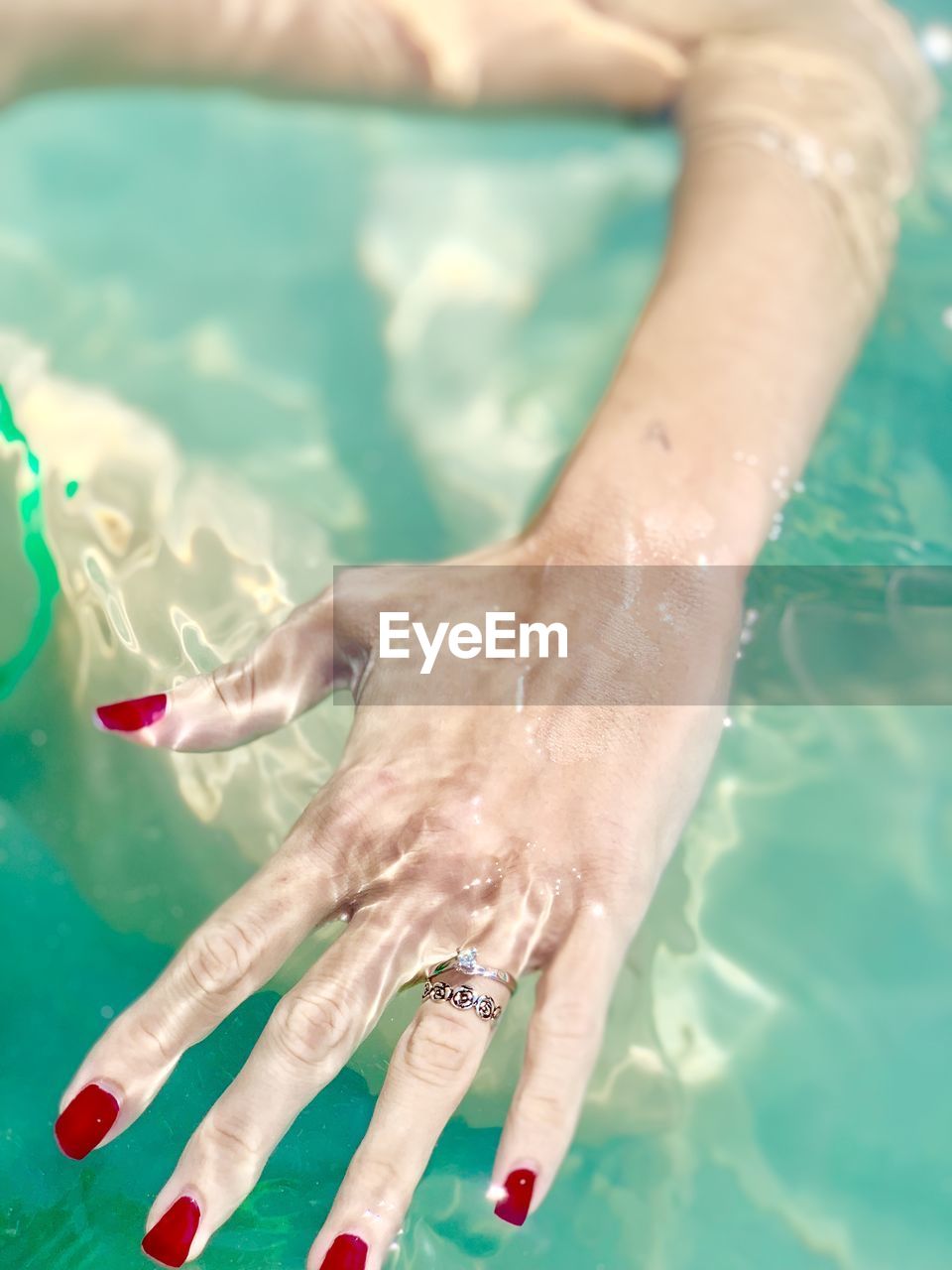 Cropped image of woman in swimming pool