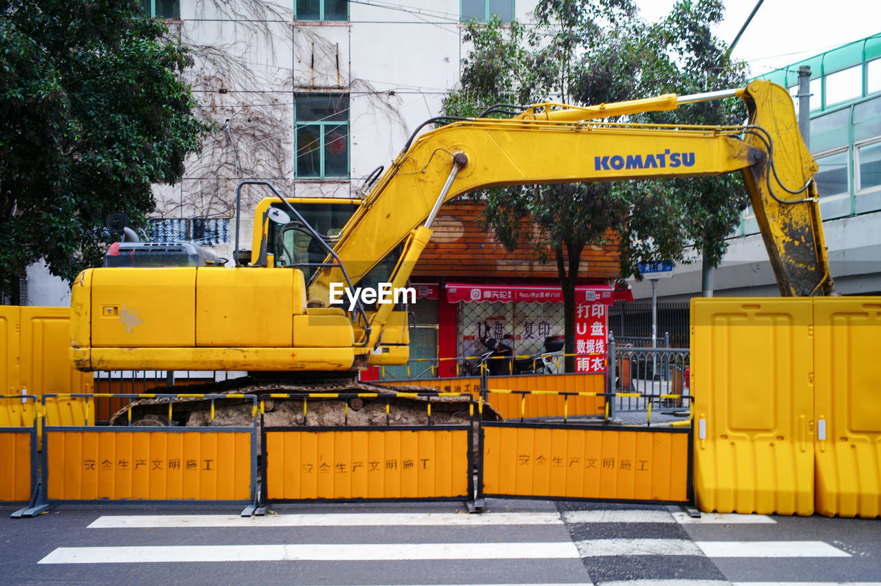 YELLOW CONSTRUCTION SITE BY ROAD