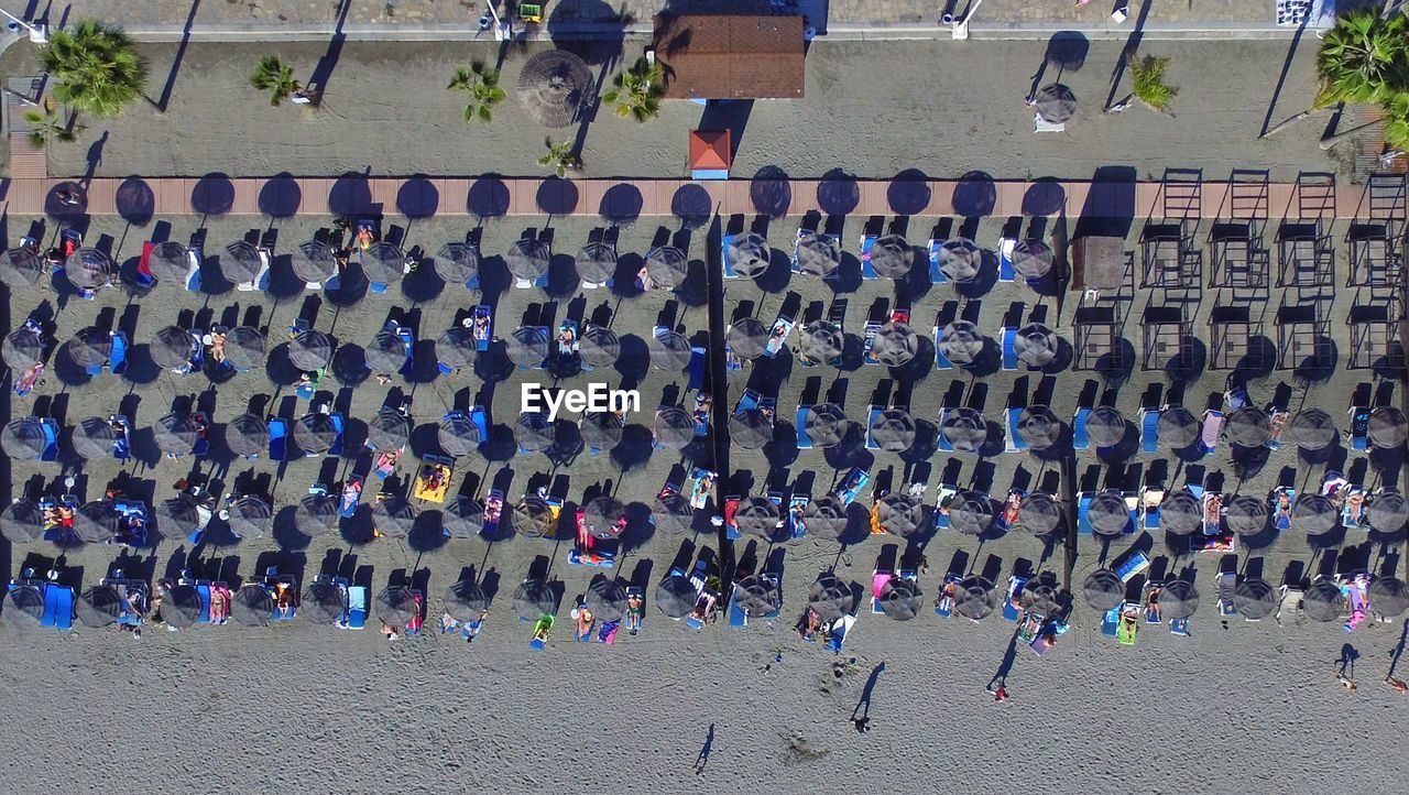 High angle view of people relaxing at beach