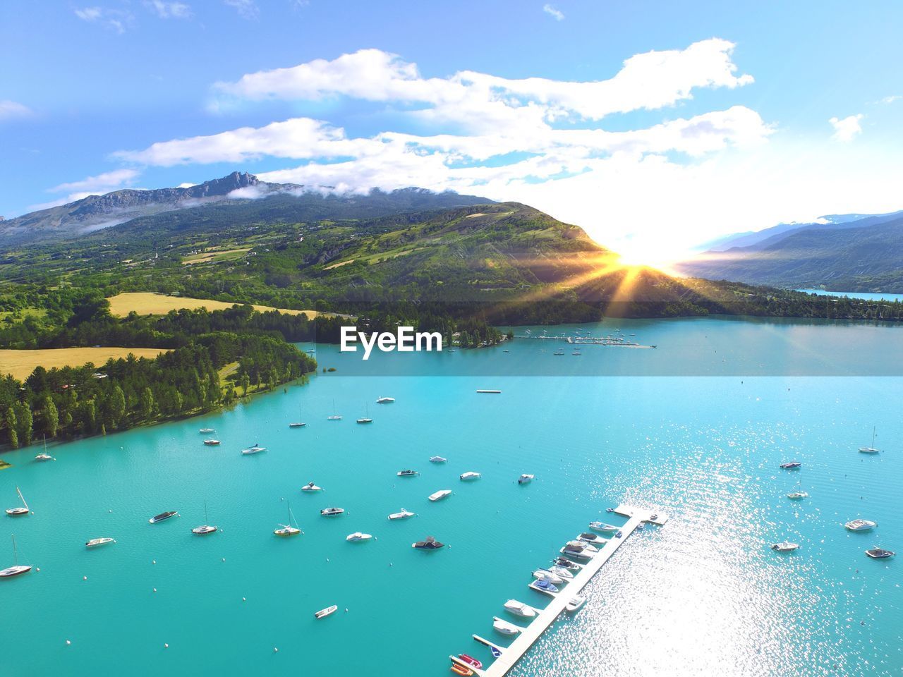 Scenic view of sea and mountain against sky