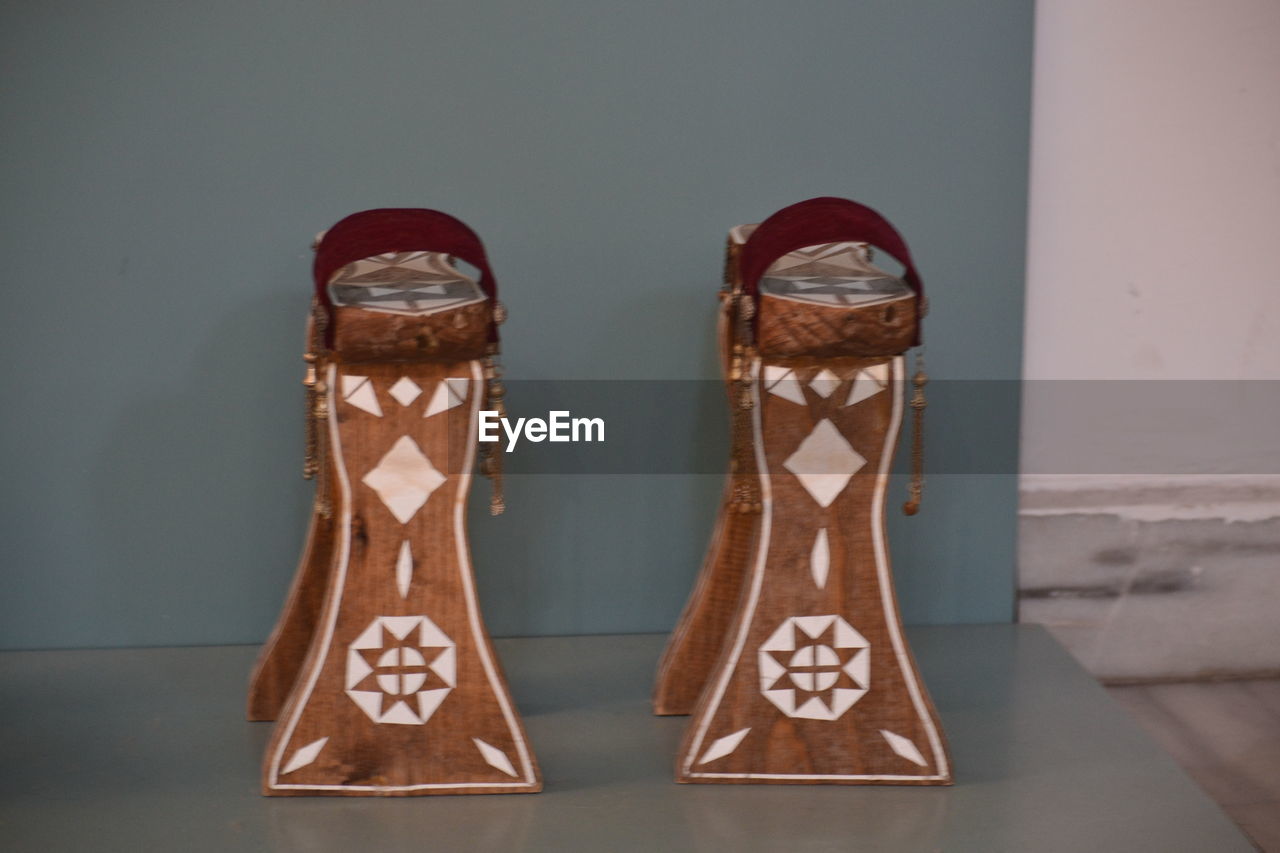 CLOSE-UP OF SHOES AGAINST WHITE BACKGROUND