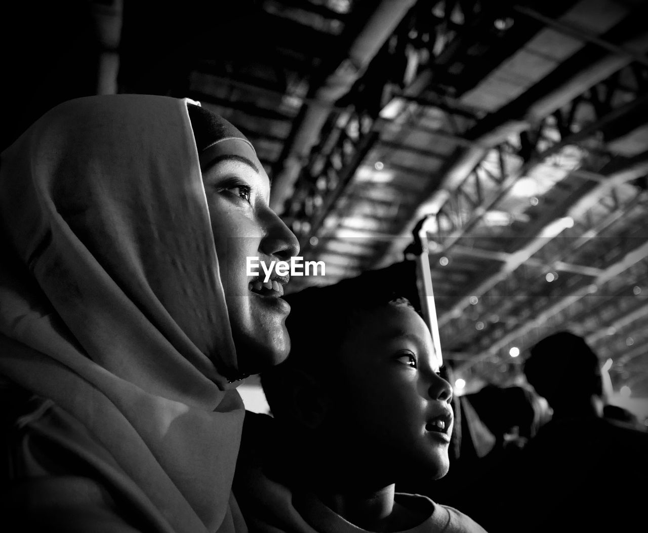 Mother and son looking away