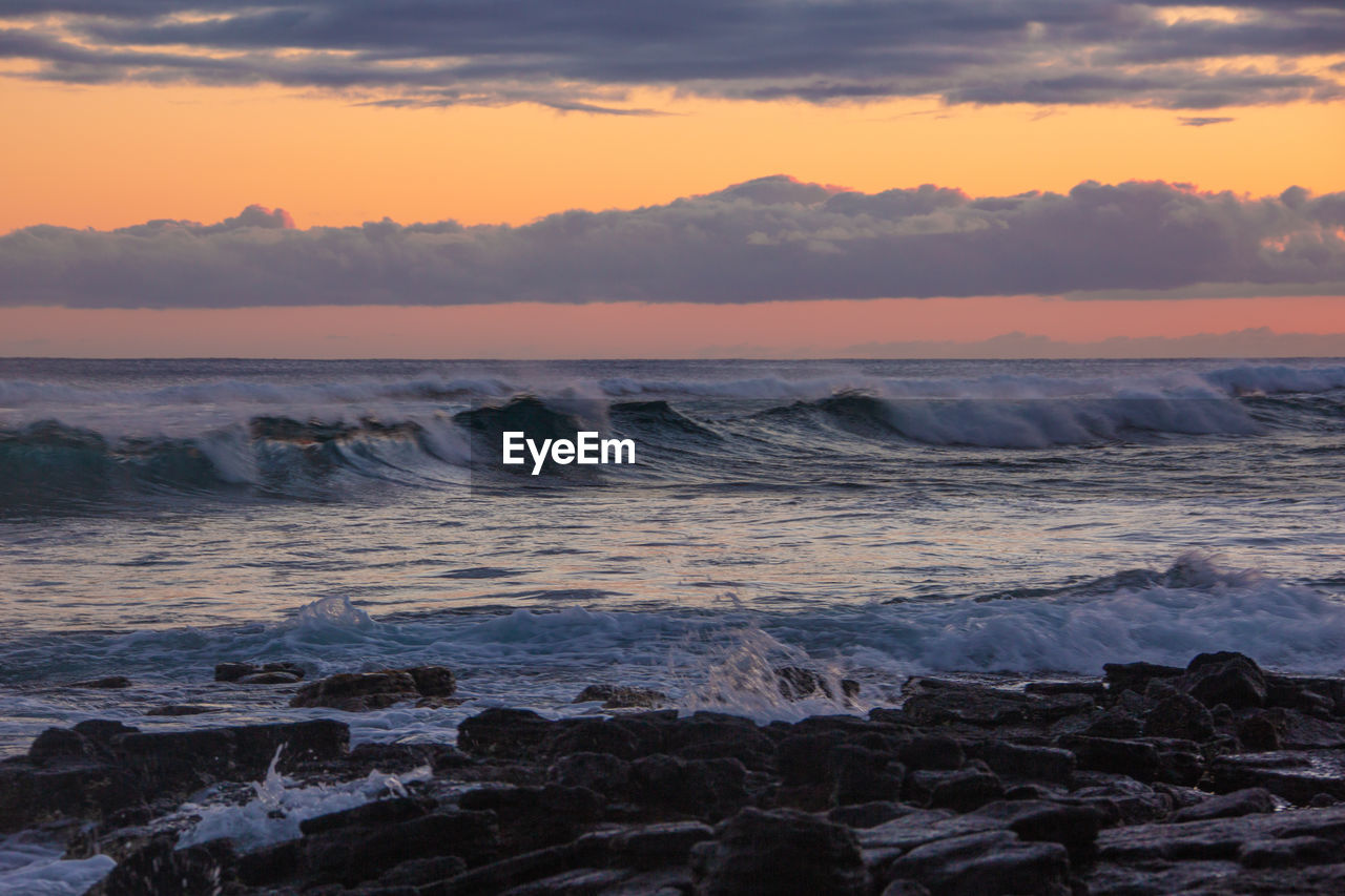 SCENIC VIEW OF SEA DURING SUNSET