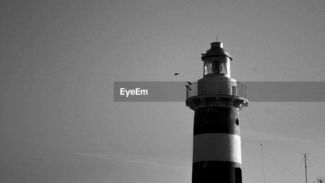 Low angle view of lighthouse against clear sky