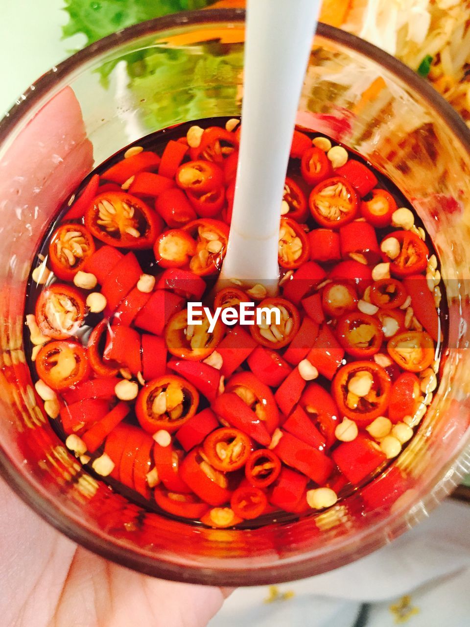 Directly above shot of chili pepper drink in glass