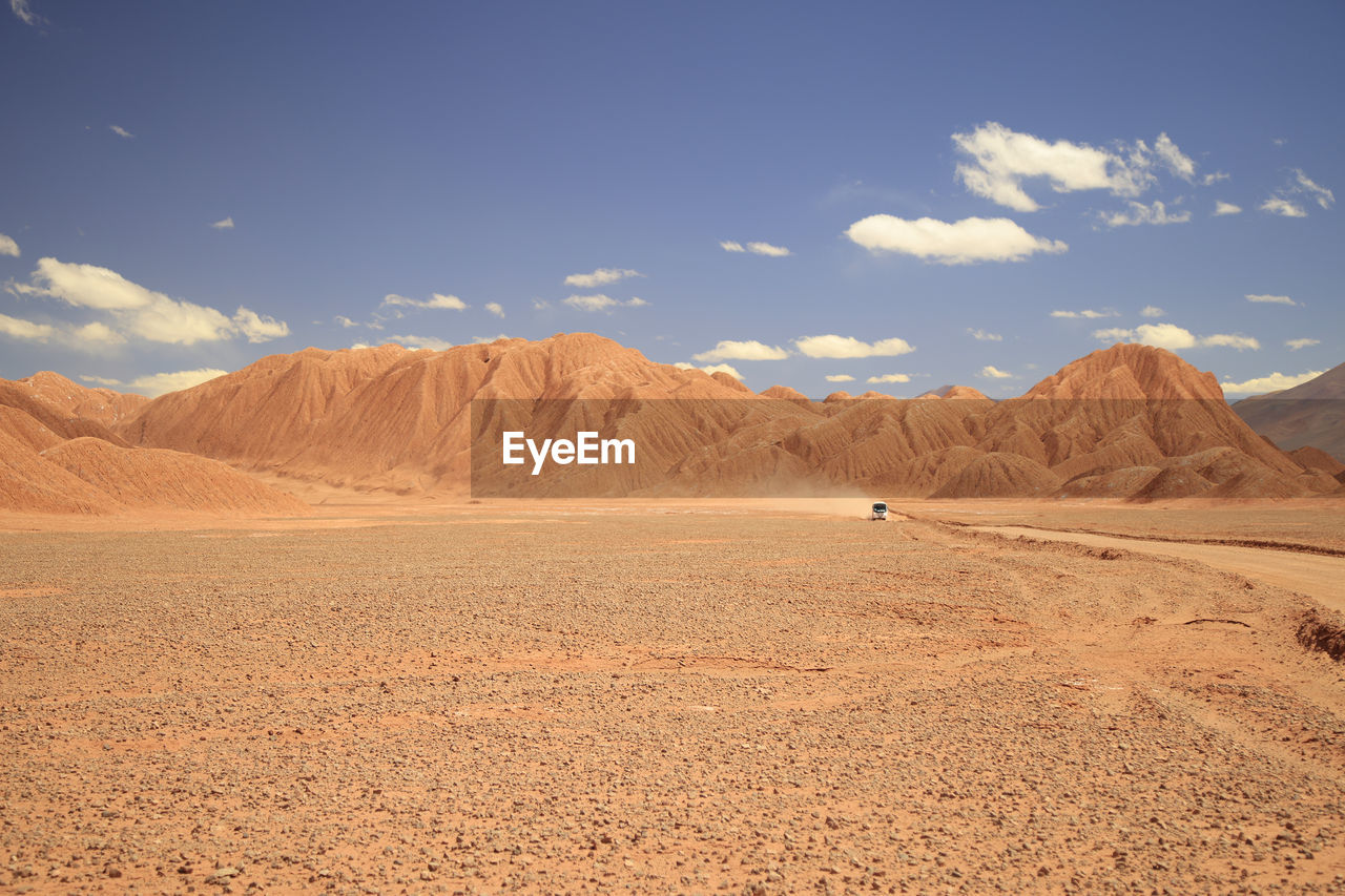 scenic view of landscape and mountains against sky