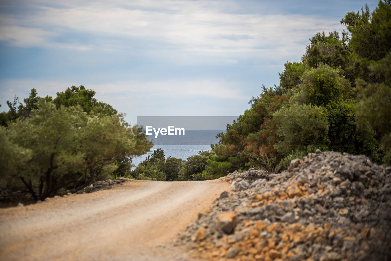 nature, sky, plant, tree, cloud, landscape, sea, land, water, rock, scenics - nature, coast, environment, hill, beauty in nature, no people, road, tranquility, rural area, shore, tranquil scene, morning, outdoors, travel, natural environment, transportation, day, travel destinations, beach, non-urban scene