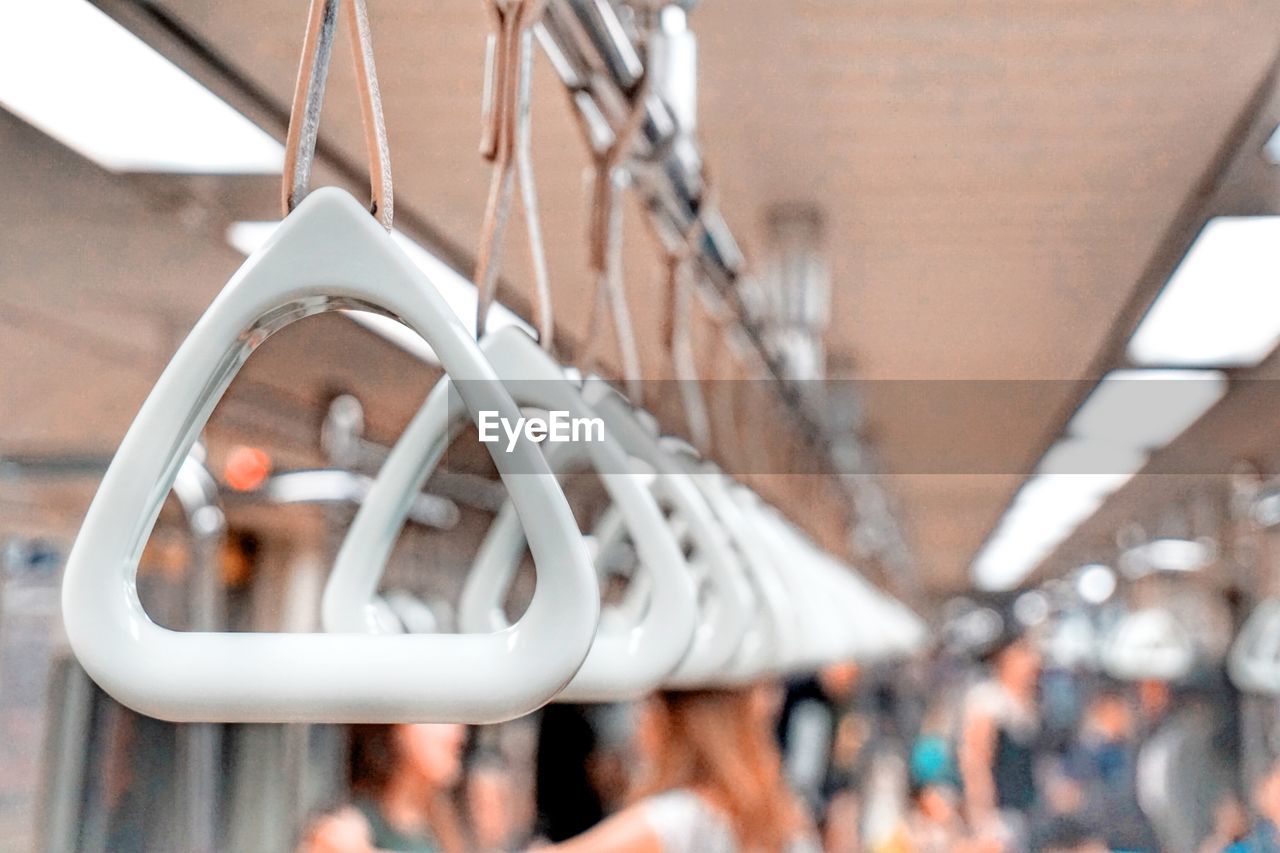 CLOSE-UP OF CHAIN HANGING ON METAL