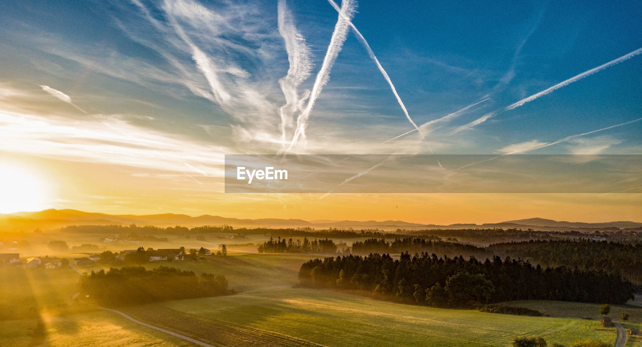 Panoramic view of bavarian landscape against sky during sunrise