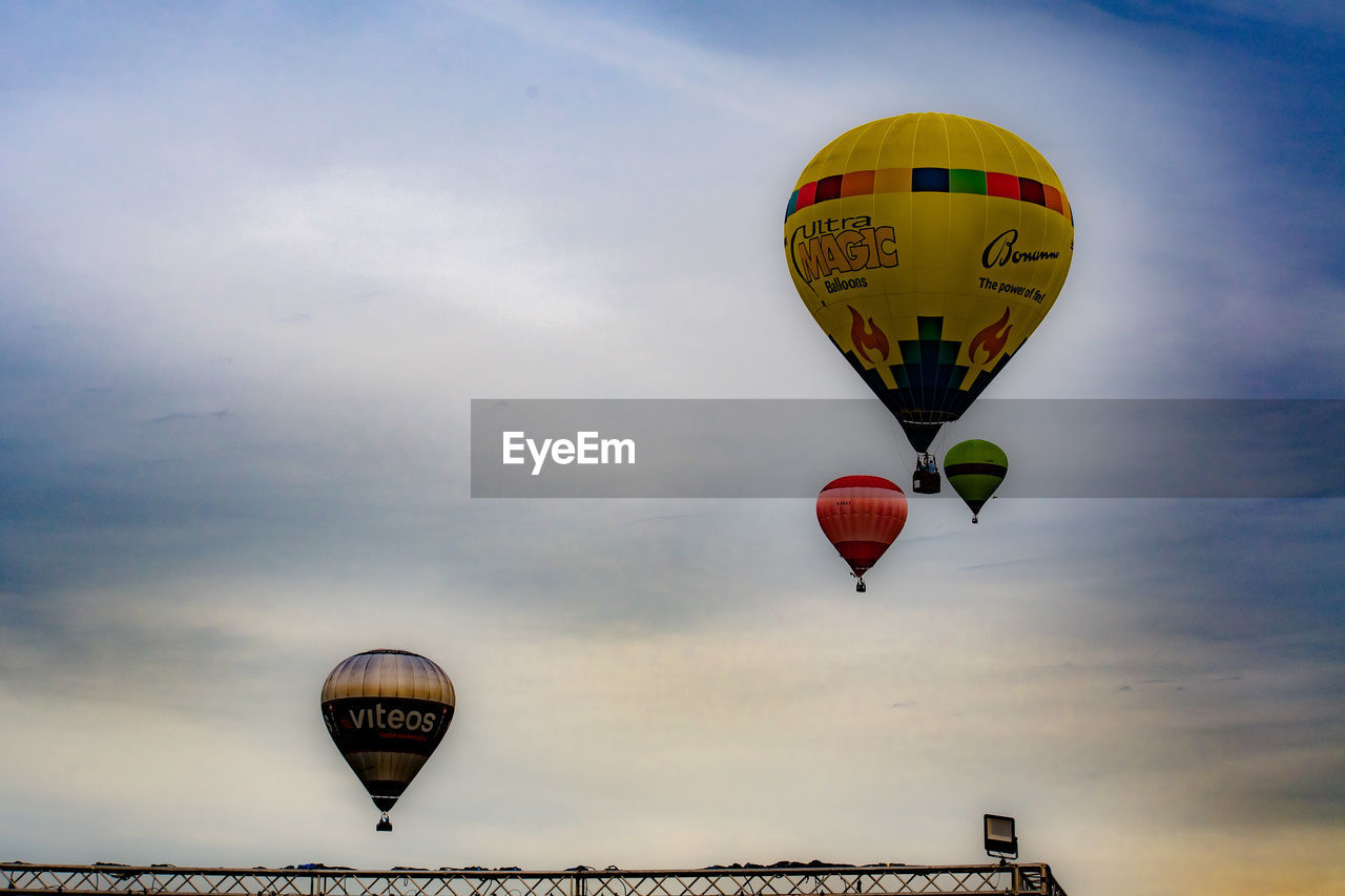 LOW ANGLE VIEW OF HOT AIR BALLOONS AGAINST SKY