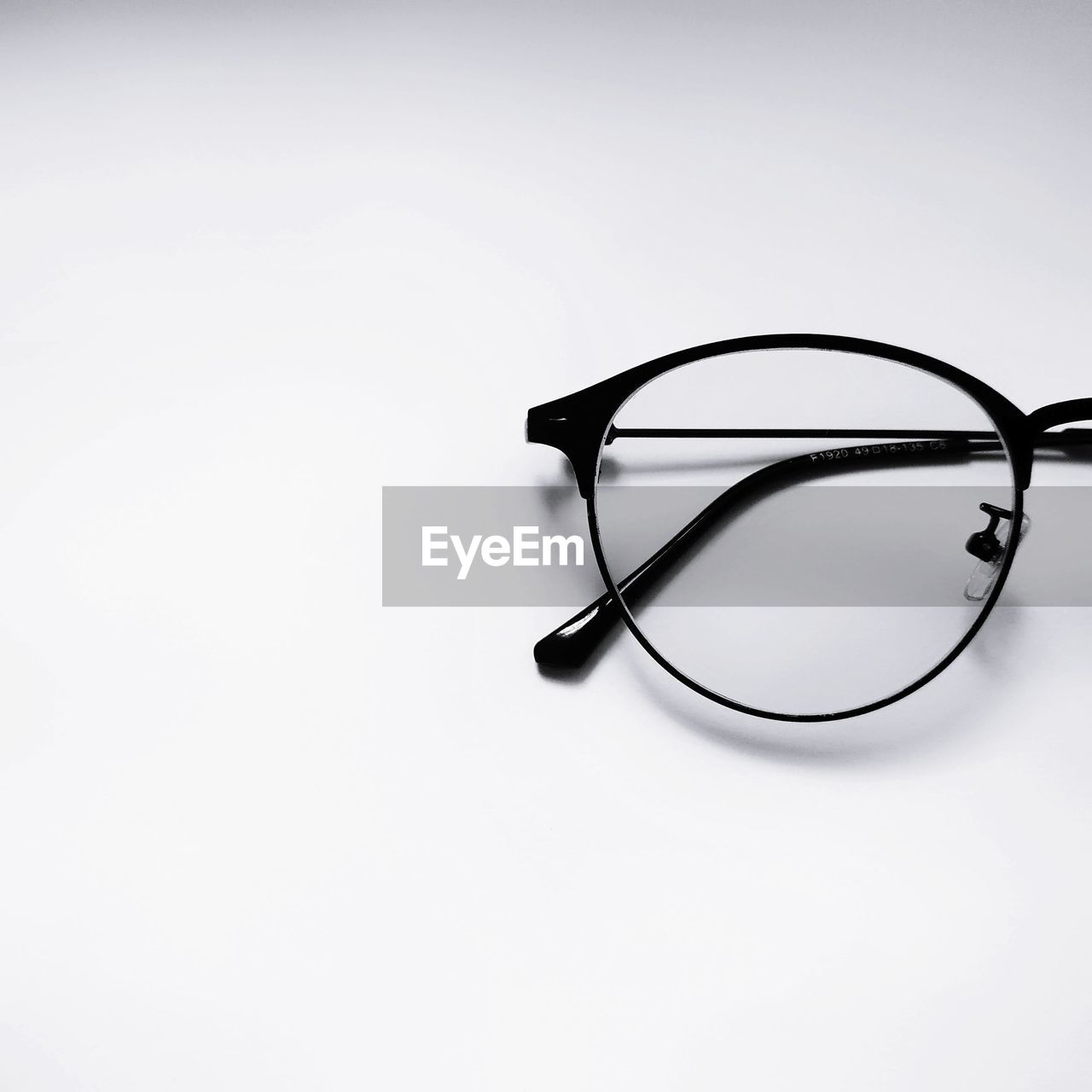 High angle view of eyeglasses against white background