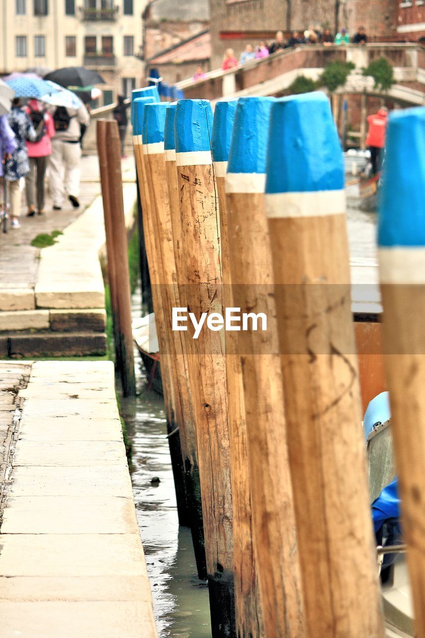 Wooden posts by pier