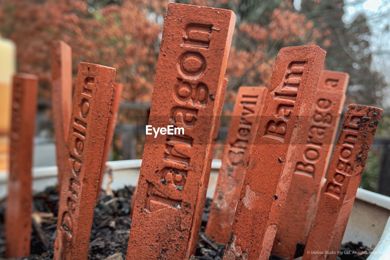 CLOSE-UP OF TEXT ON METAL STRUCTURE