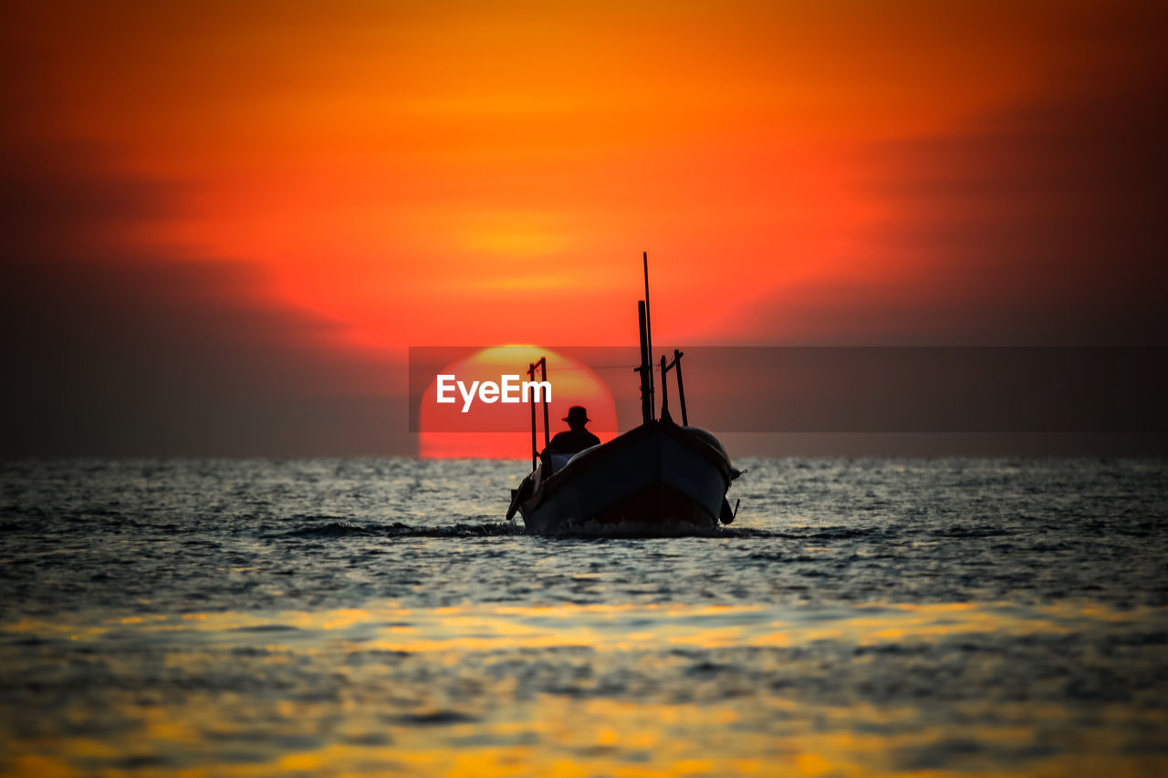 scenic view of sea against orange sky