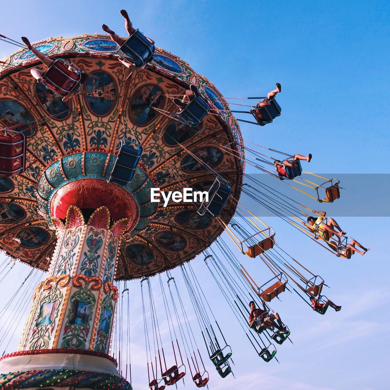 LOW ANGLE VIEW OF CAROUSEL AGAINST SKY