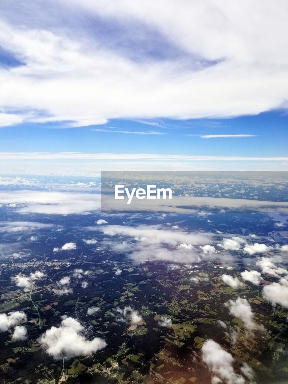 AERIAL VIEW OF LANDSCAPE AGAINST CLOUDY SKY