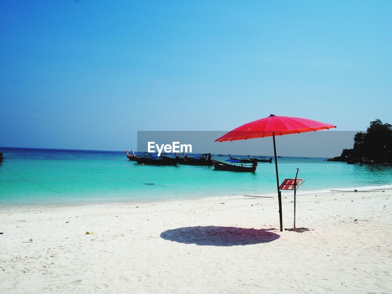 Scenic view of beach against clear sky