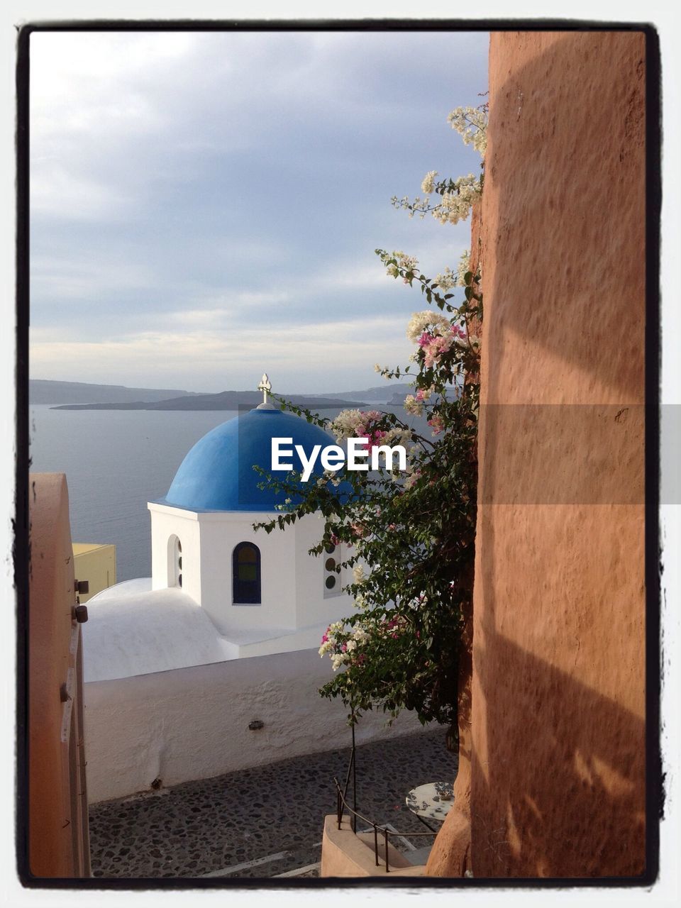 Church dome against calm sea