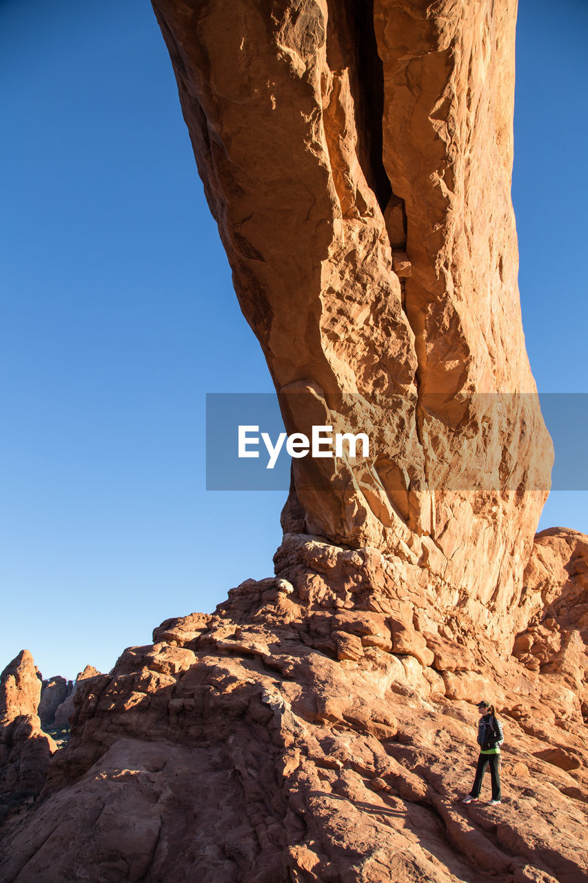 ROCK FORMATION AGAINST CLEAR SKY