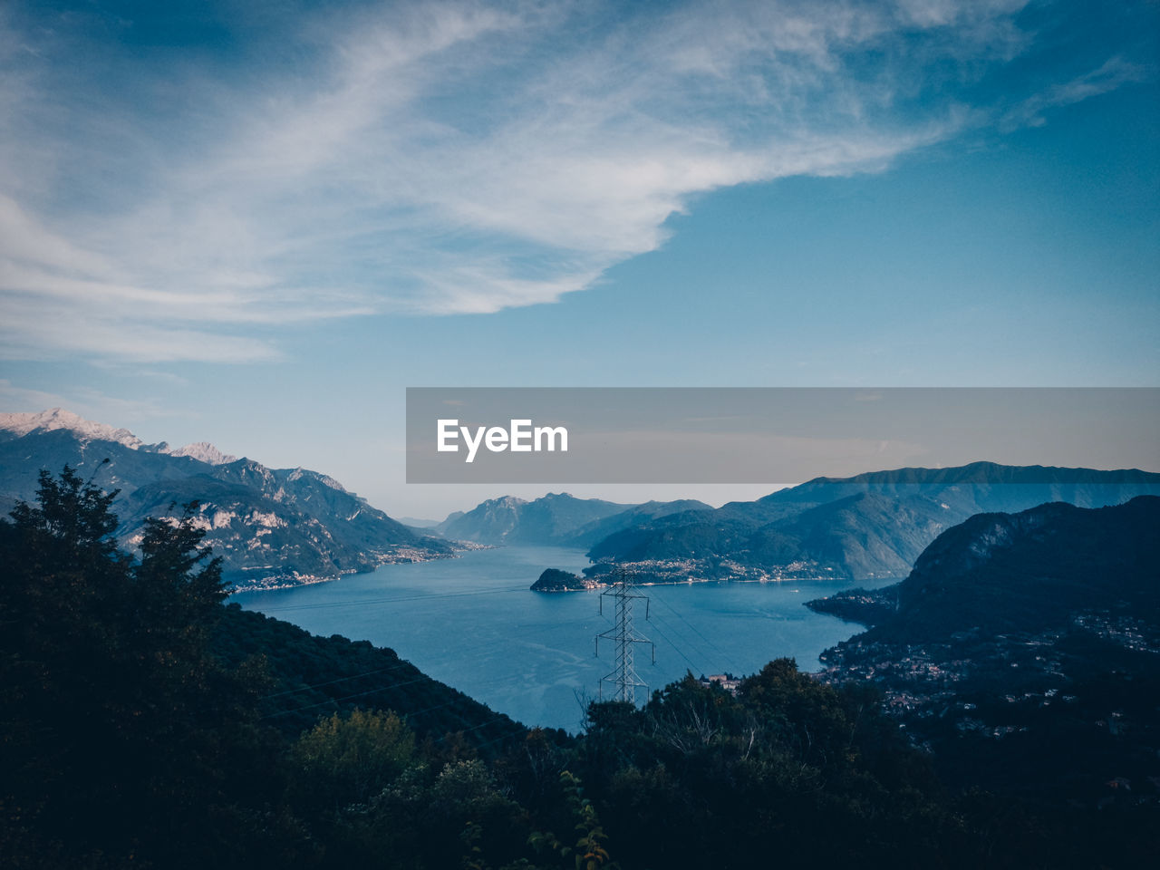 HIGH ANGLE VIEW OF MOUNTAINS AND SEA AGAINST SKY