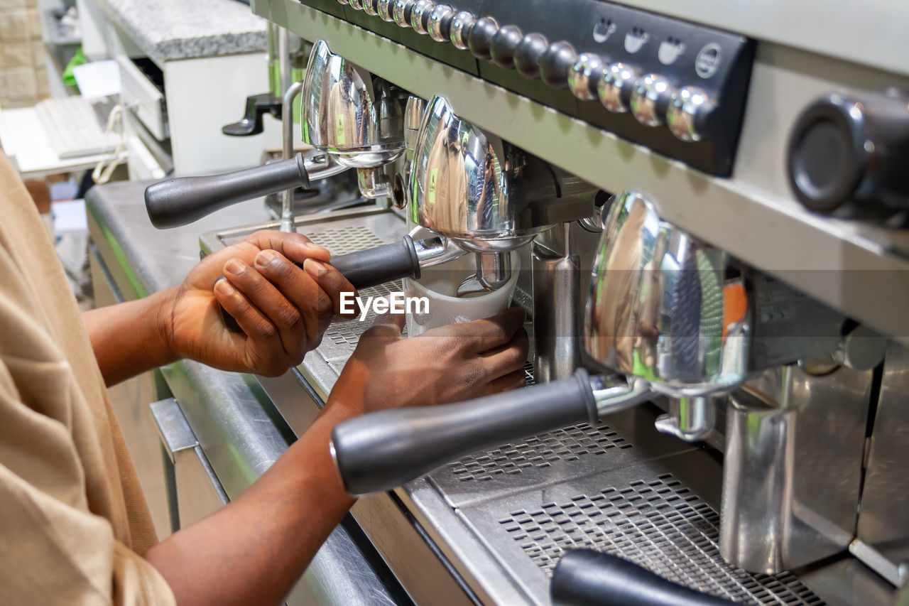 MAN WORKING IN KITCHEN