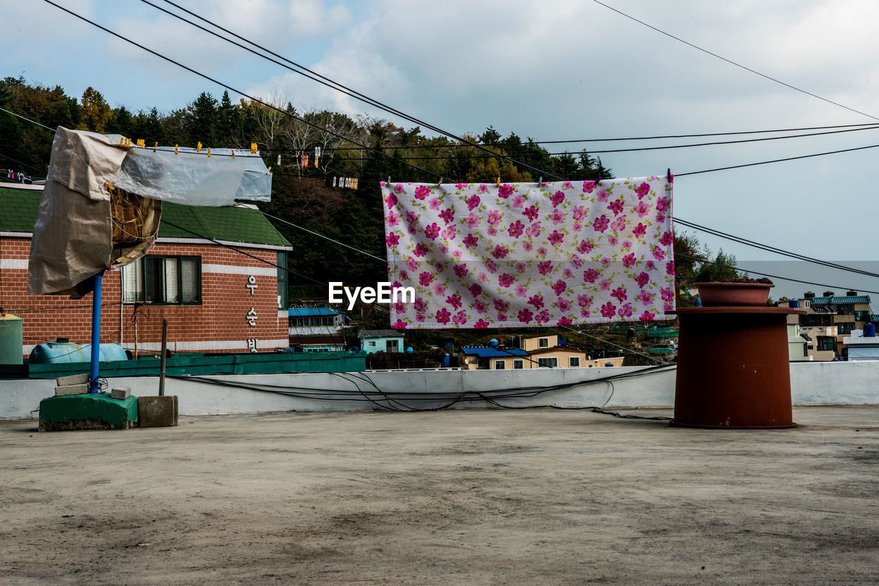 Fabric drying on building terrace