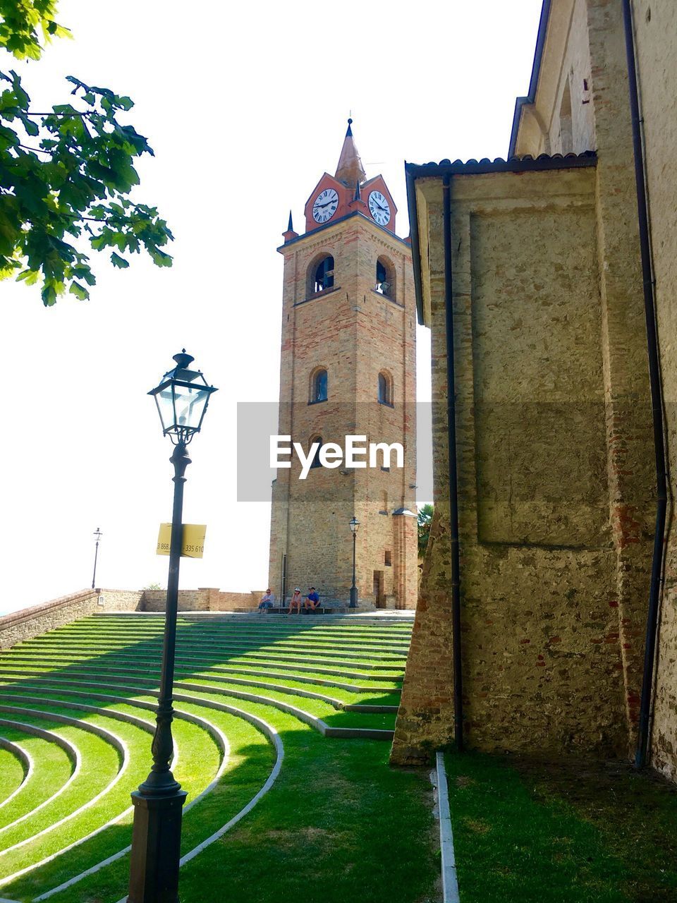 VIEW OF TOWER AND GRASS AGAINST SKY