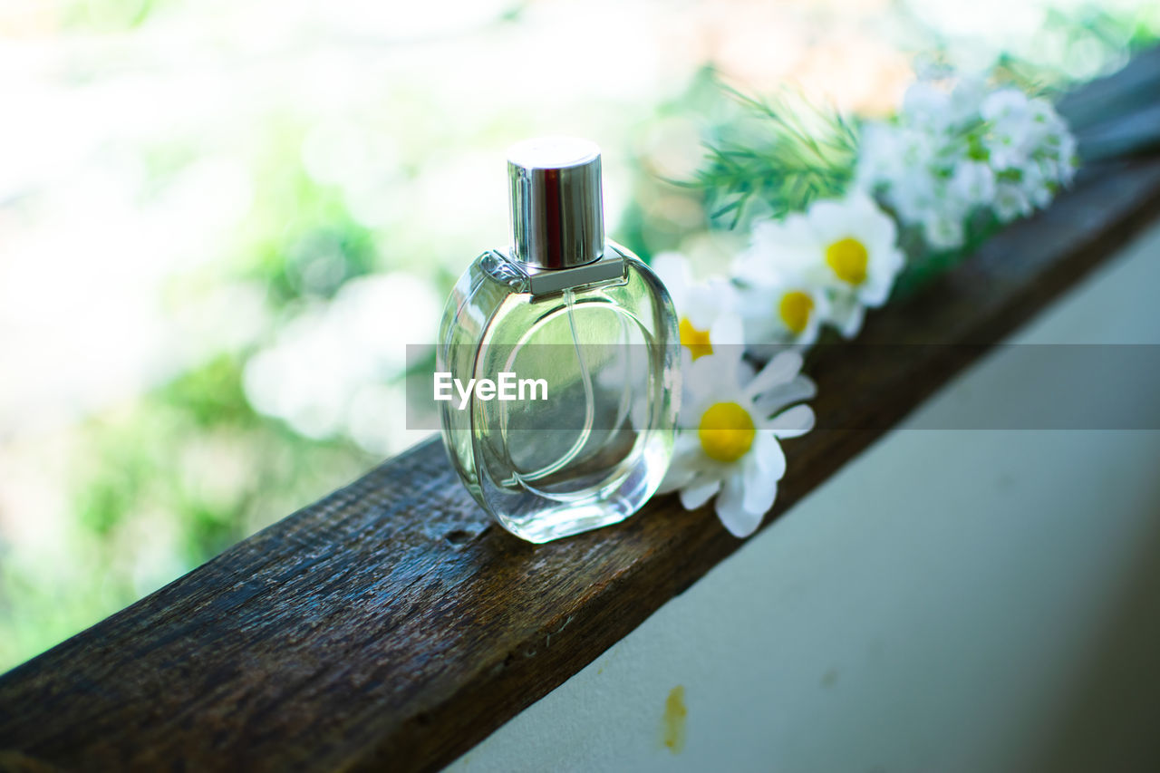 Perfume spray bottle and flower 