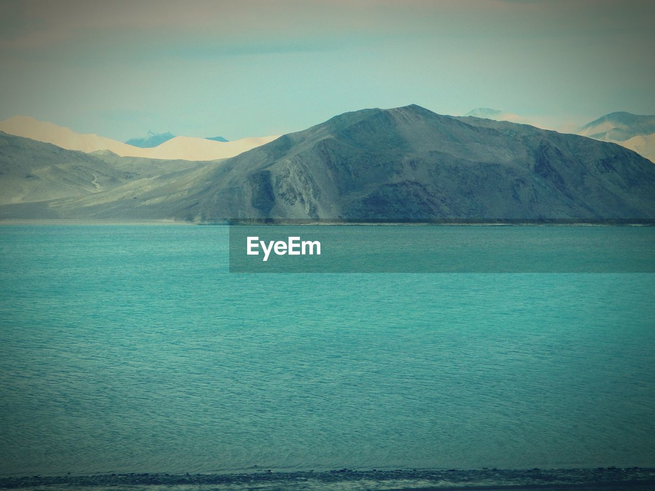 View of sea with mountain in background