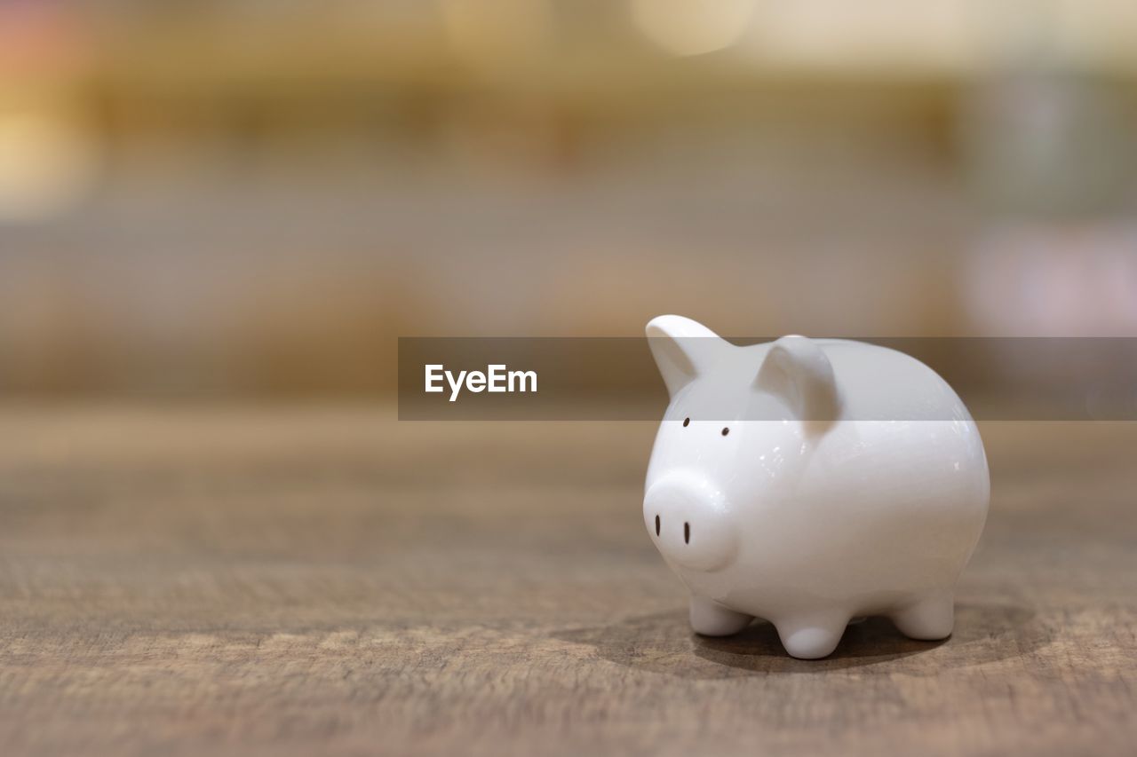 Close-up of piggy bank on table