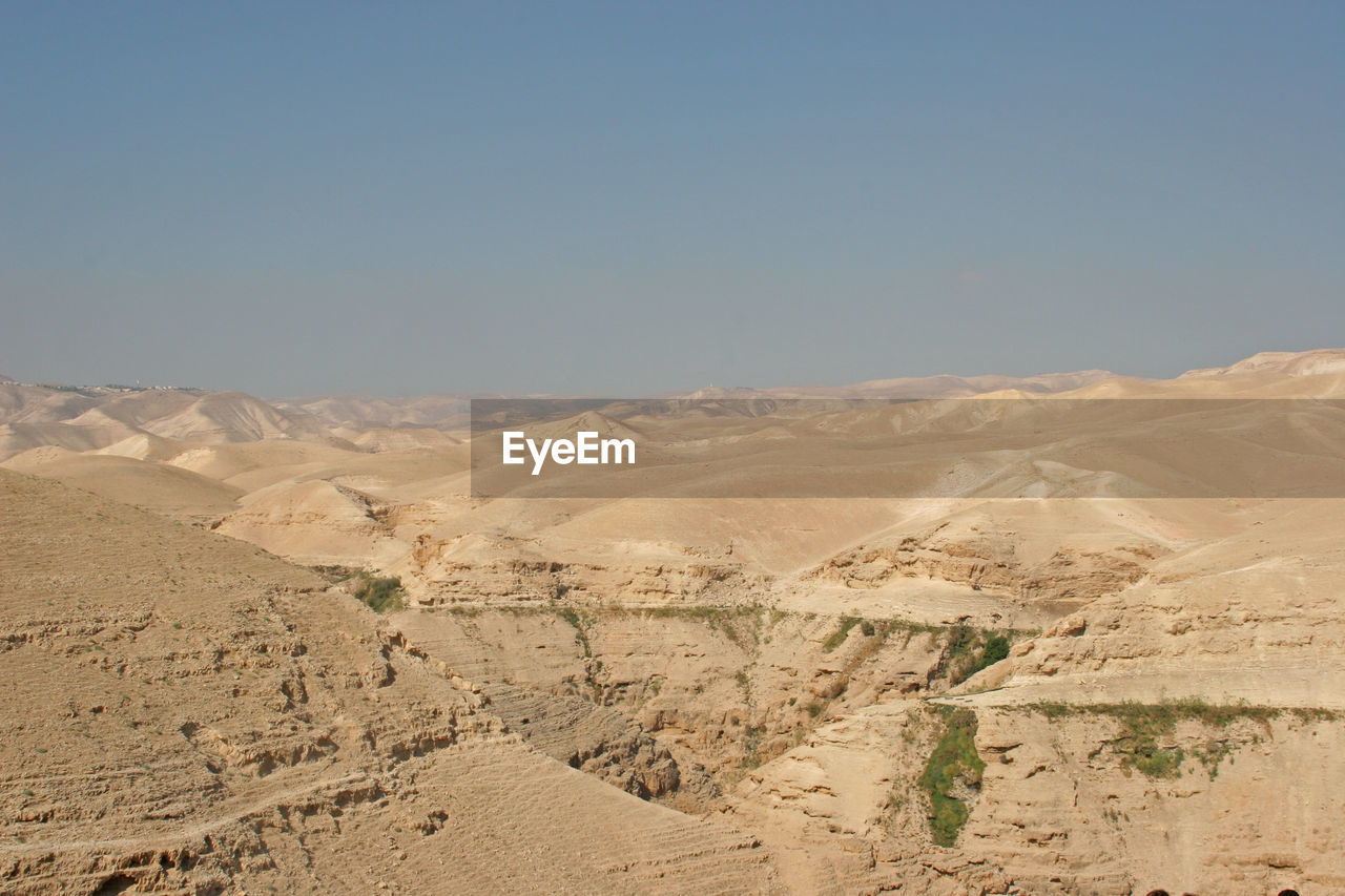 Scenic view of dramatic landscape at judea desert against clear sky