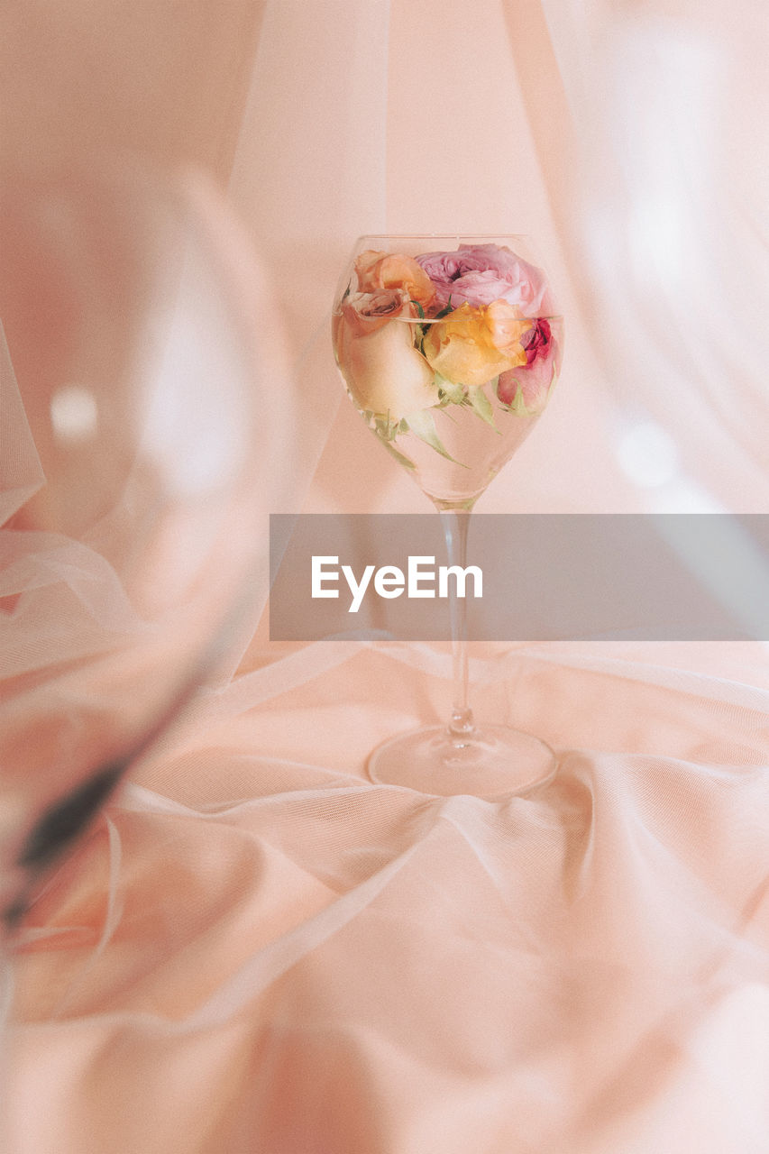 Roses in a wineglass