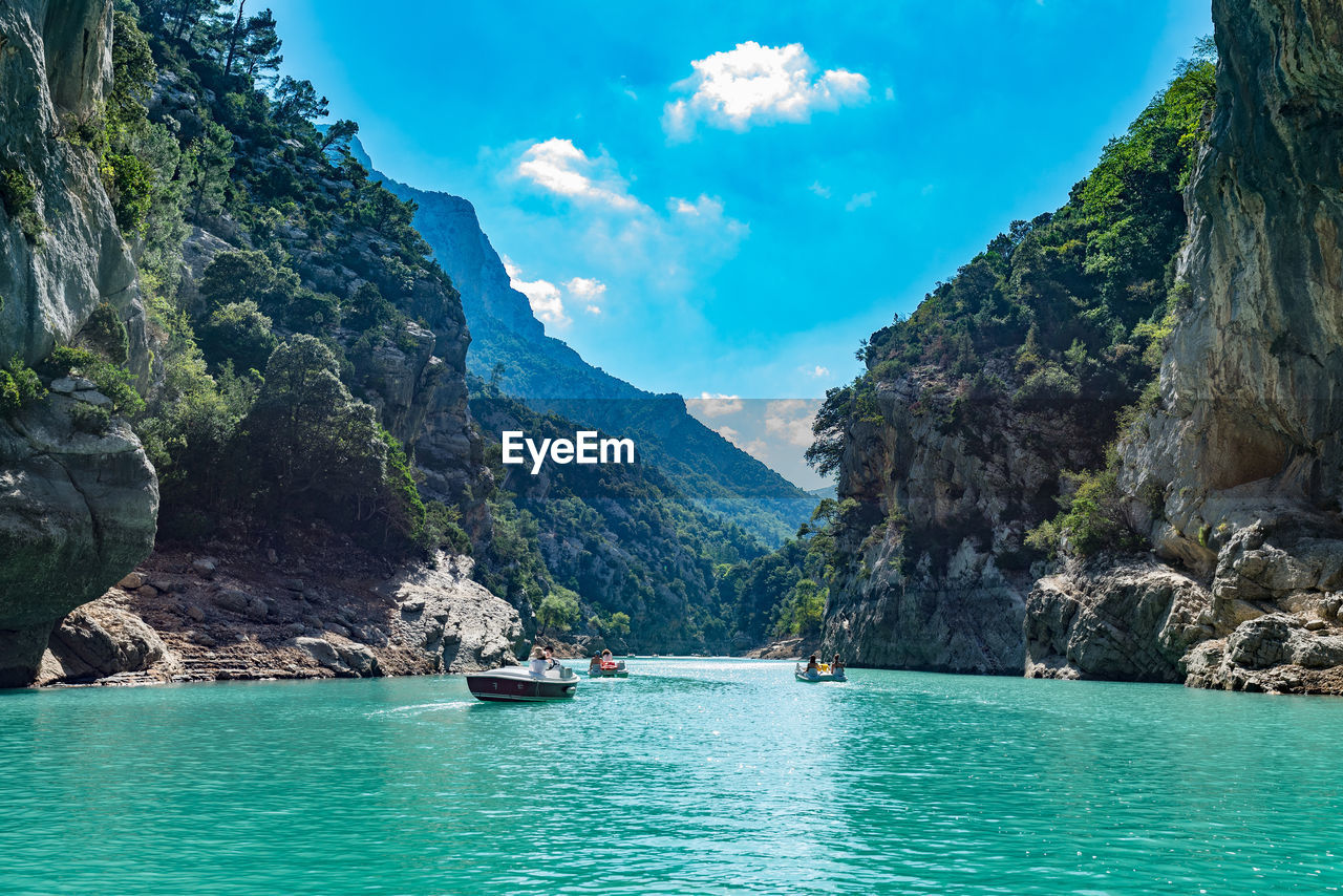 Panoramic view of sea and mountains against sky