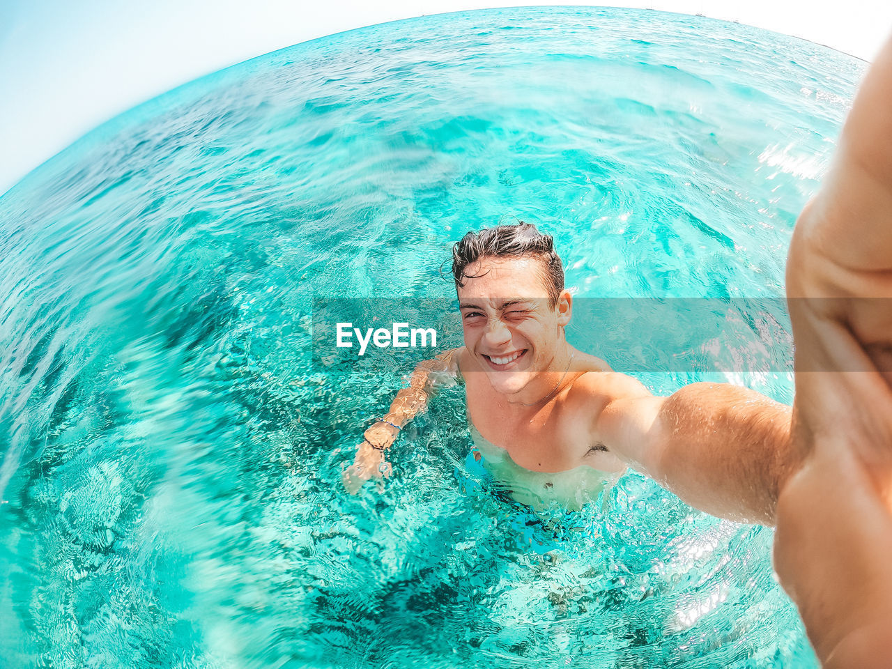 Portrait of man swimming in sea