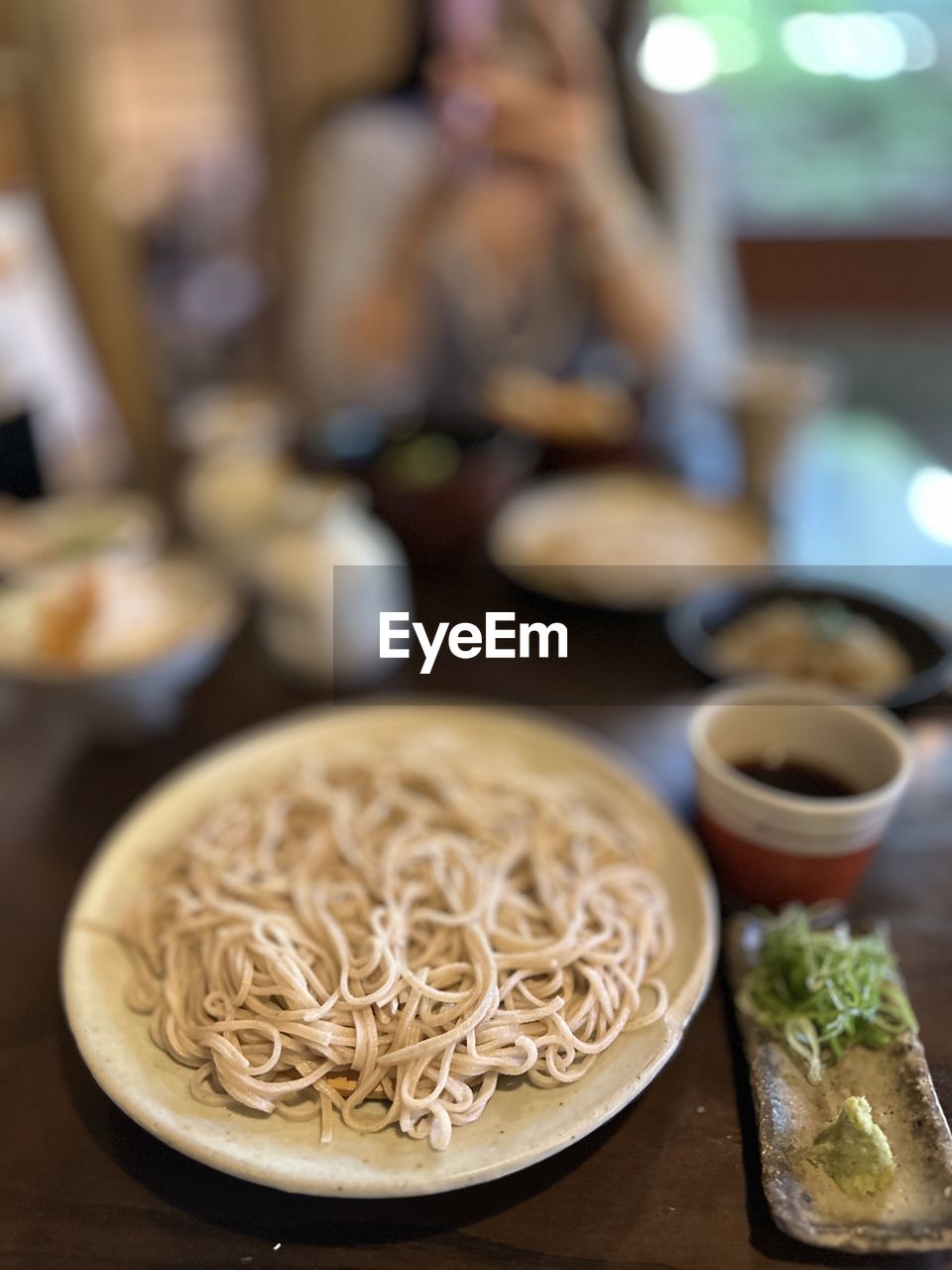 food and drink, food, dish, meal, indoors, healthy eating, freshness, wellbeing, table, cuisine, focus on foreground, vegetable, selective focus, plate, adult, bowl, asian food, domestic room, italian food, business, pasta