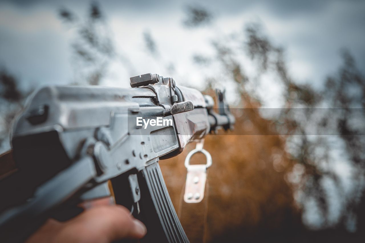 low angle view of man holding key ring