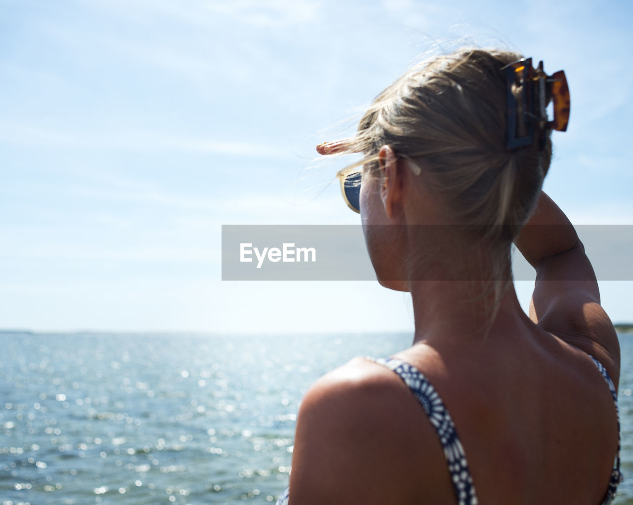 A woman scouting over the ocean