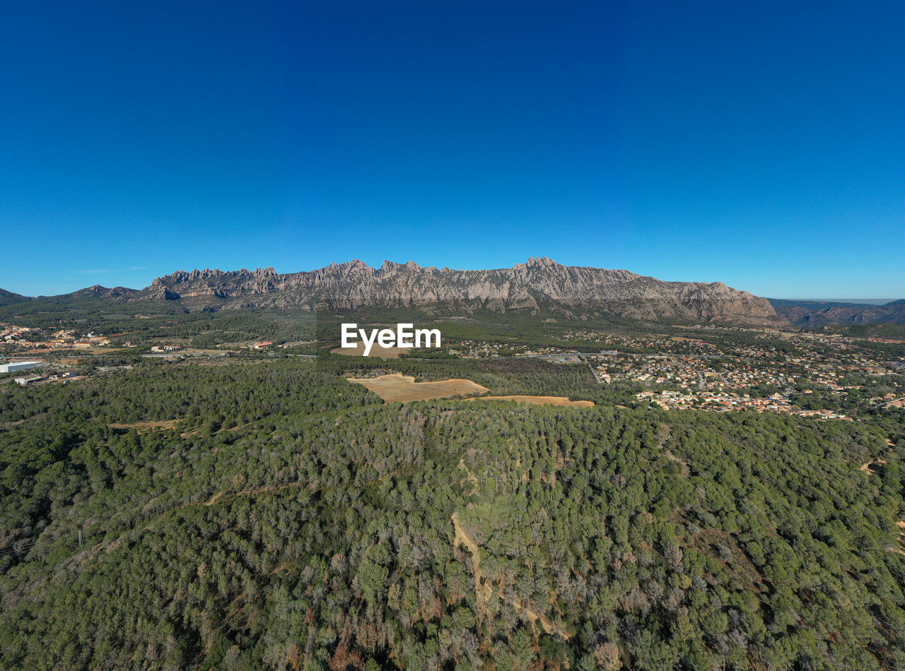 landscape, environment, scenics - nature, land, sky, nature, mountain, blue, beauty in nature, plant, no people, clear sky, wilderness, agriculture, natural environment, rural scene, outdoors, travel, tree, travel destinations, non-urban scene, tranquility, plateau, sunny, field, day, ridge, horizon, tranquil scene, tourism, valley, mountain range, plain, food and drink, growth