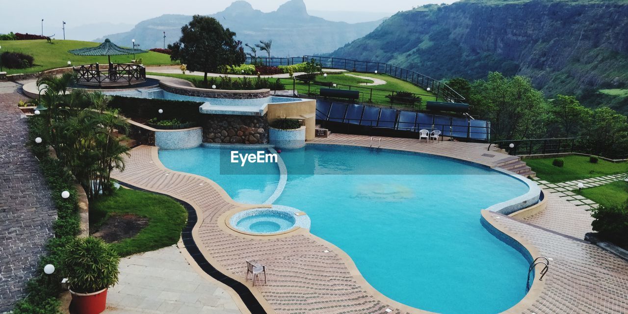 HIGH ANGLE VIEW OF SWIMMING POOL AT MOUNTAIN