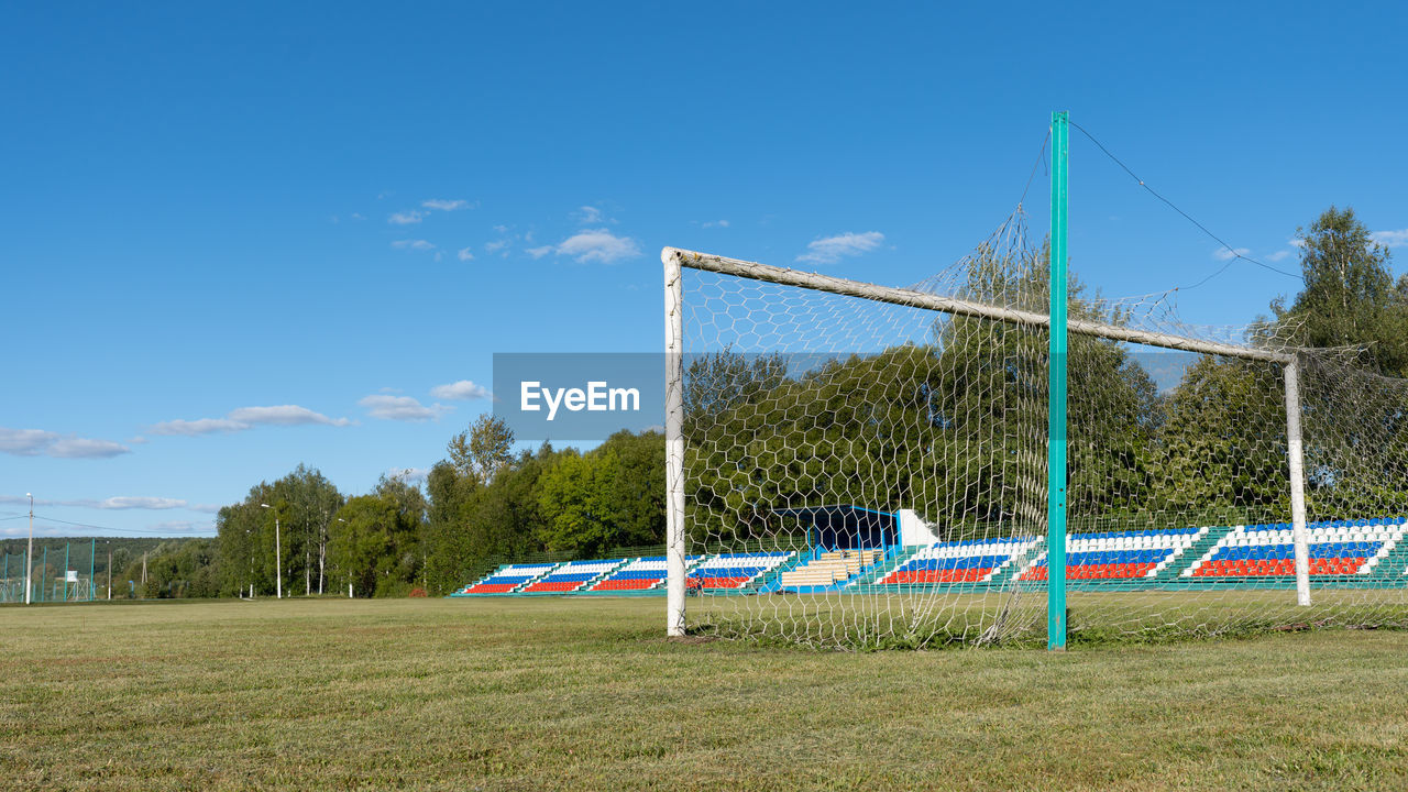 Soccer field against blue sky