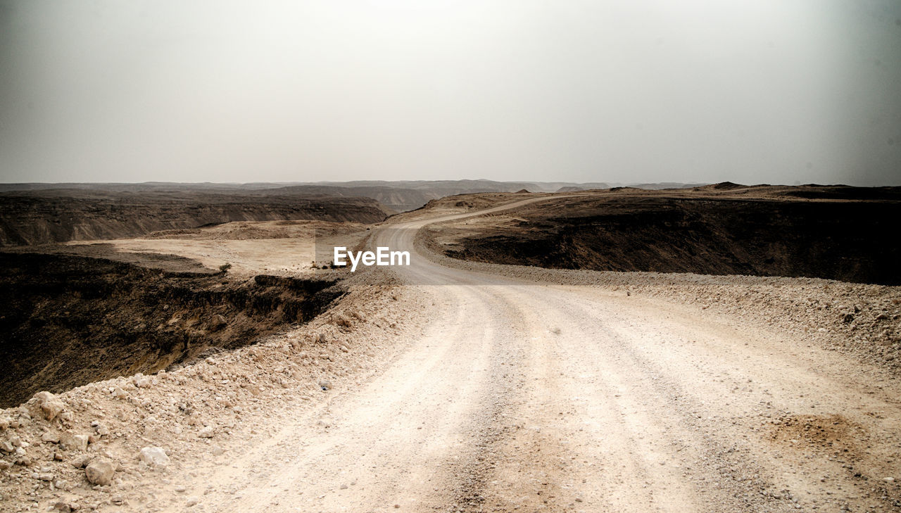 DIRT ROAD LEADING TOWARDS SKY