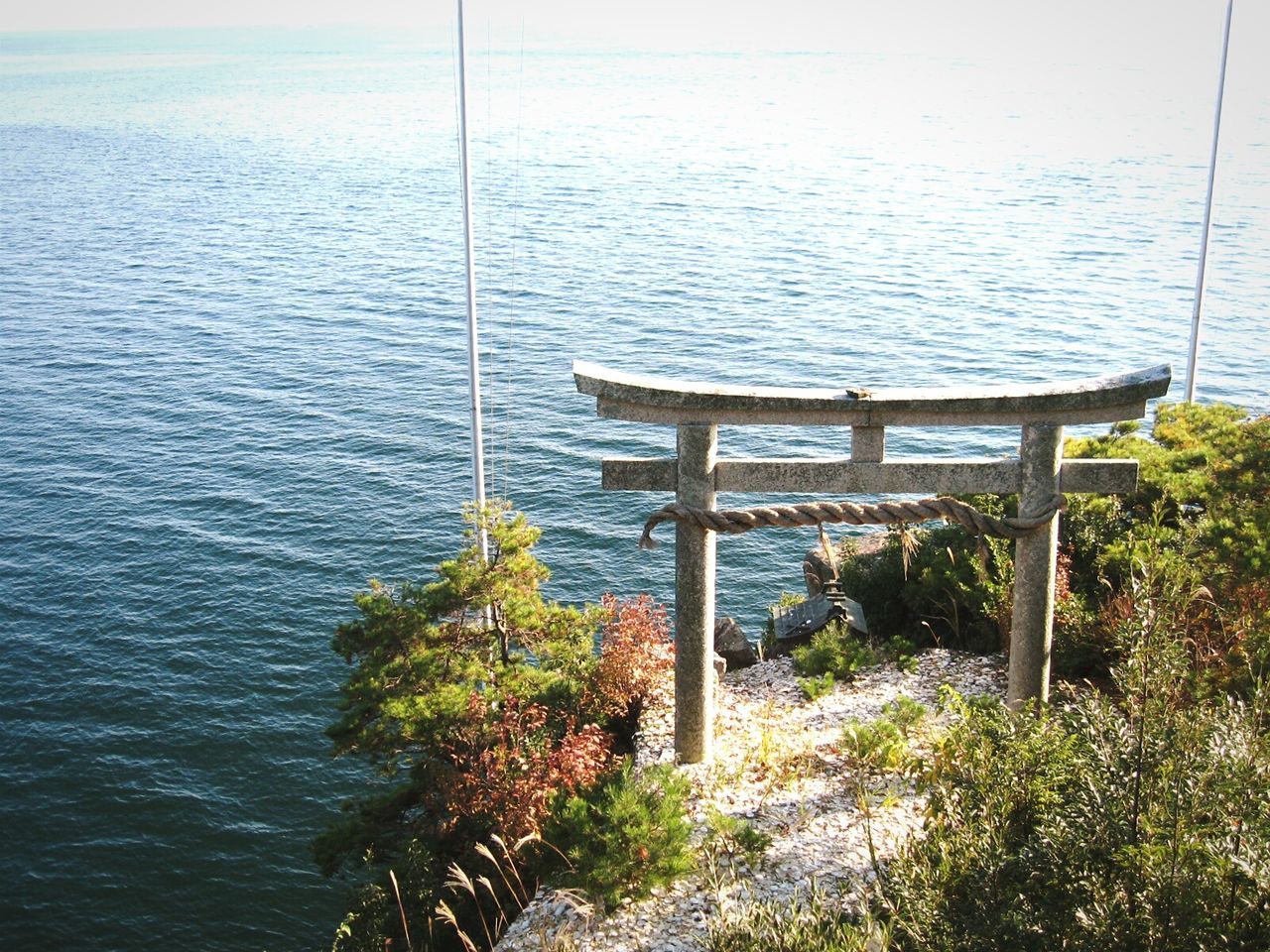 View of torii gate structure at coast