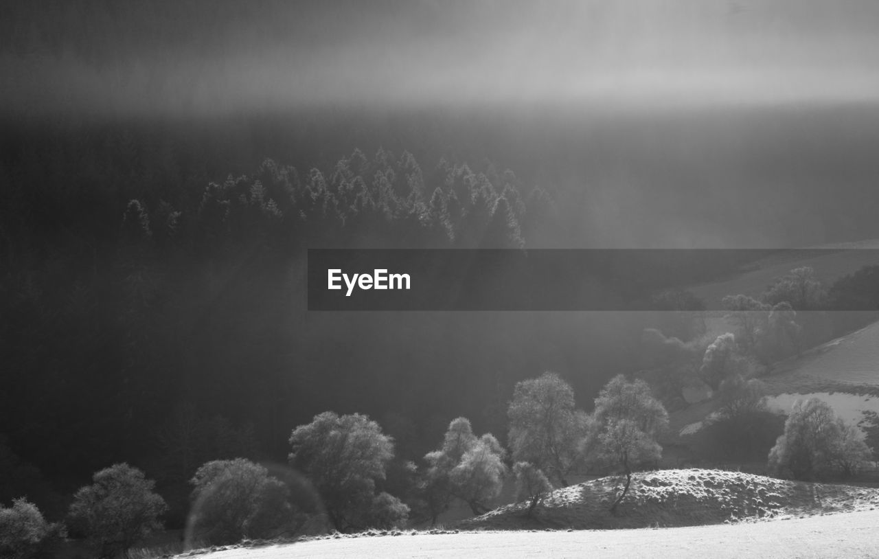 Scenic view of landscape against sky during winter