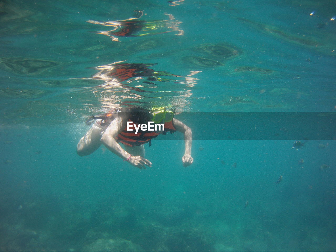 Woman swimming in sea