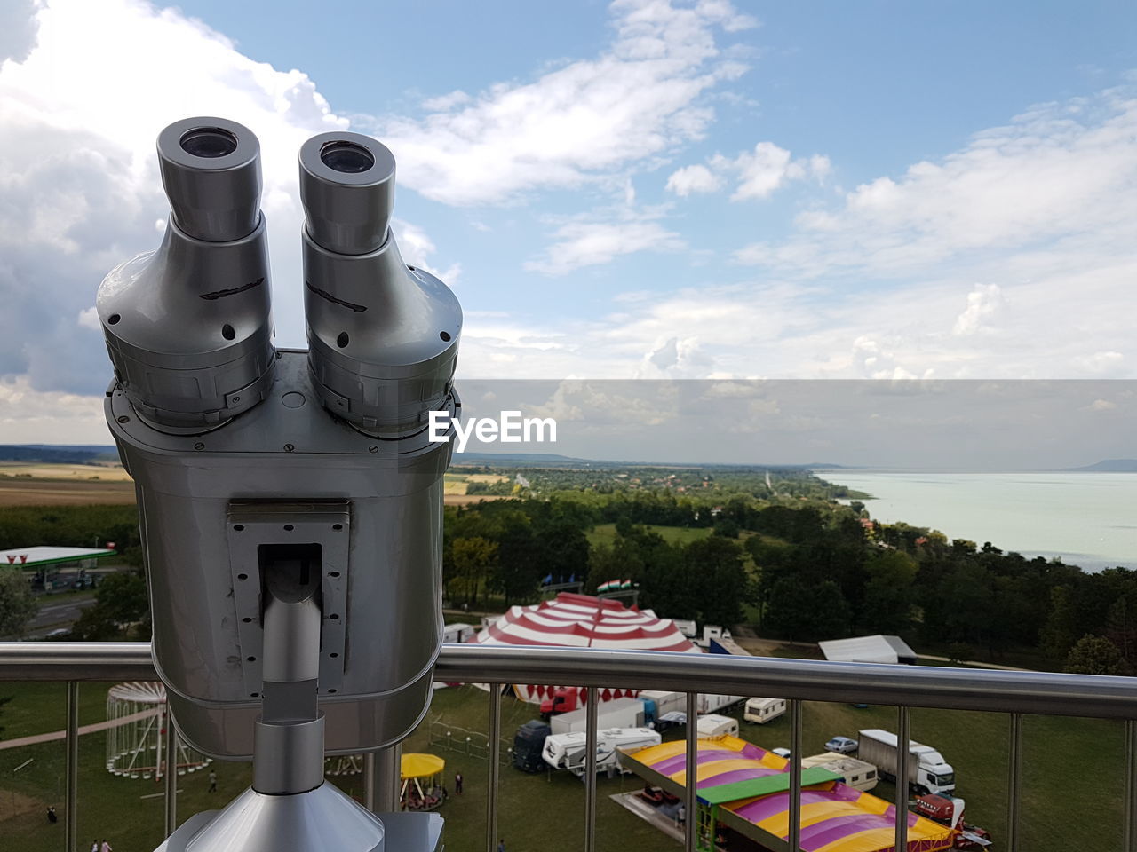 Coin-operated binoculars against sky