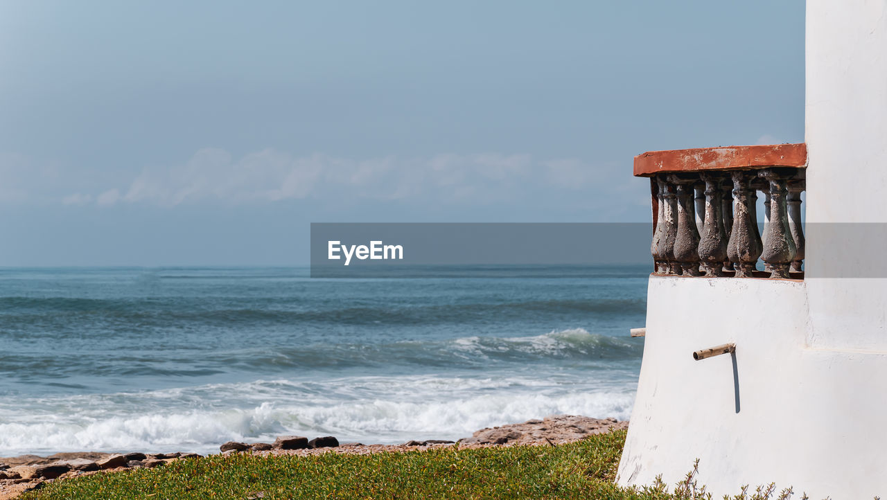 Views of the coast of west africa in ghana with an old balcony overlooking the sea.