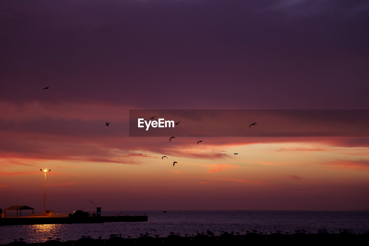 Scenic view of sea at sunset